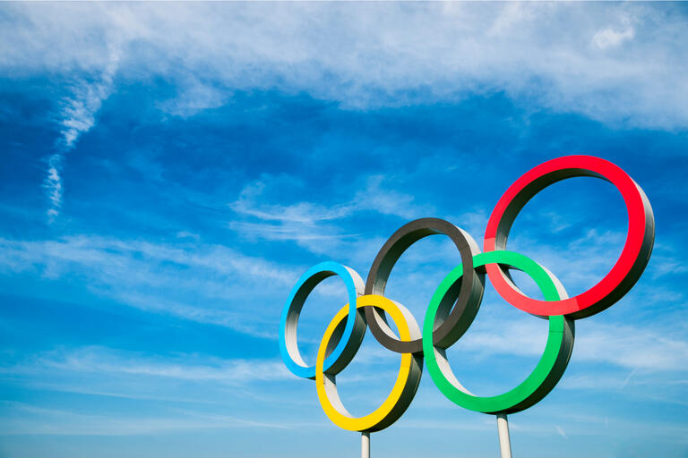 Olympic rings amidst blue sky