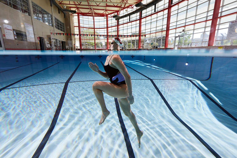 woman running in pool