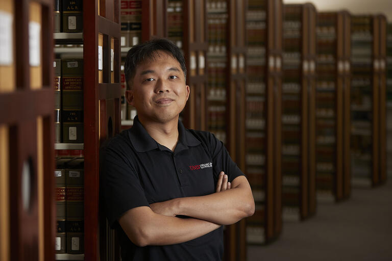 man posing in library