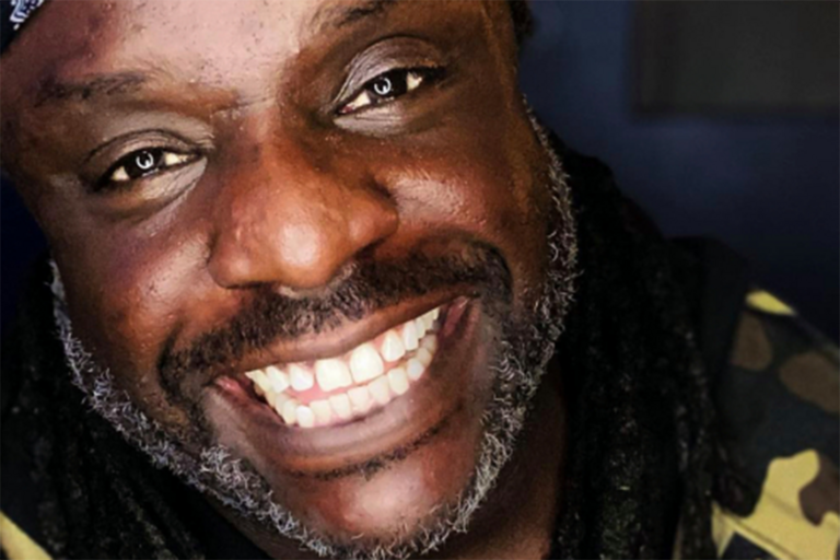 close up of Tyler Merritt's face as he's smiling