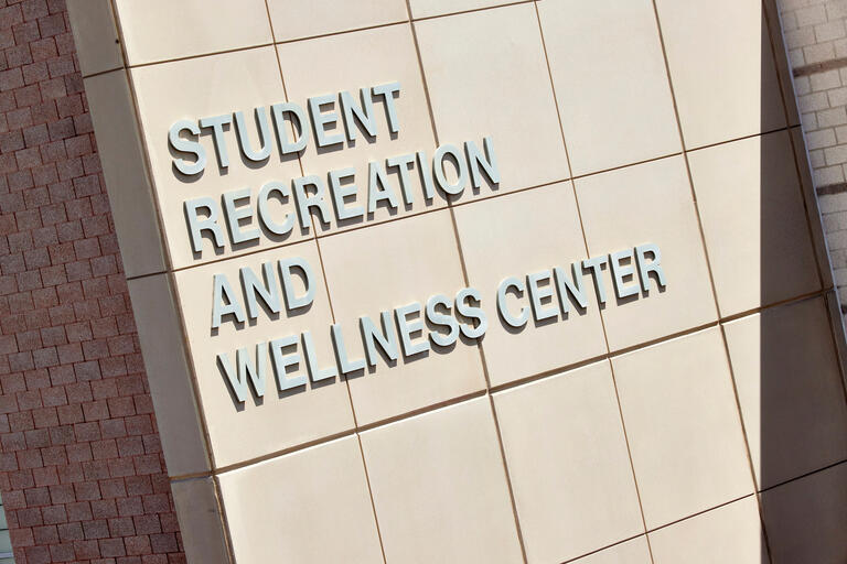 image of the side of a building with words that read: student recreation and wellness center