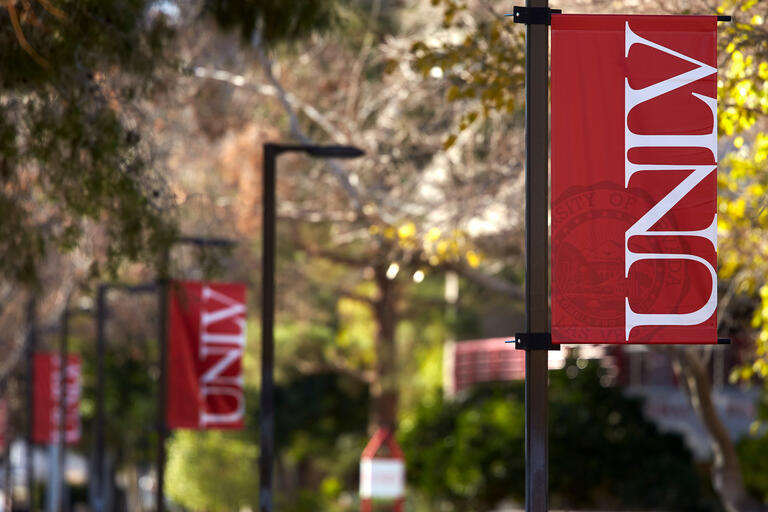 red banners on a campus that read UNLV