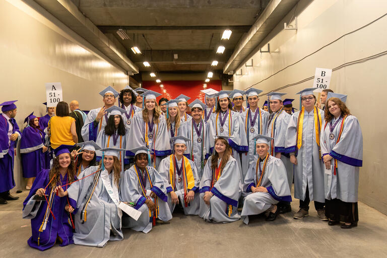 group of students in graduation gowns