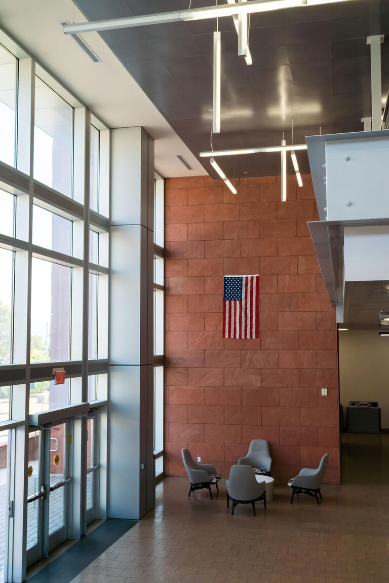 Greenspull Hall commons area with a flag displayed