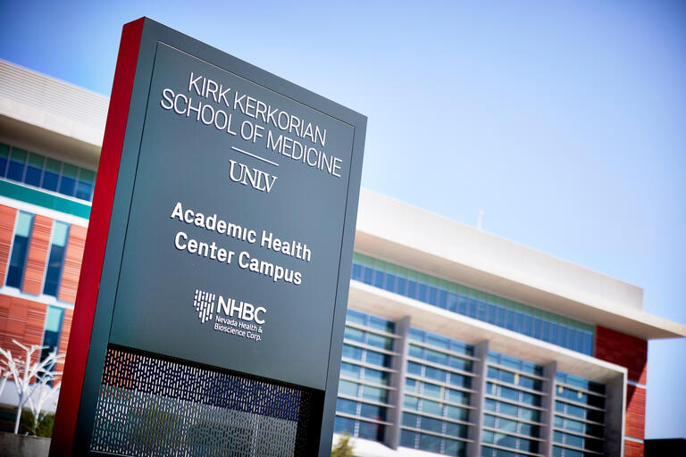 close up of sign that reads kirk kerkorian school of medicine at unlv, academic healthcare campus