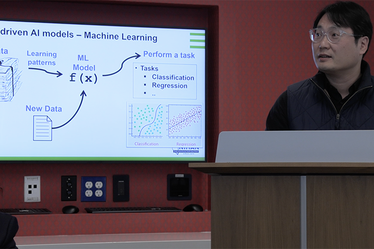 UNLV lecturer displays a presentation on data-driven AI Models