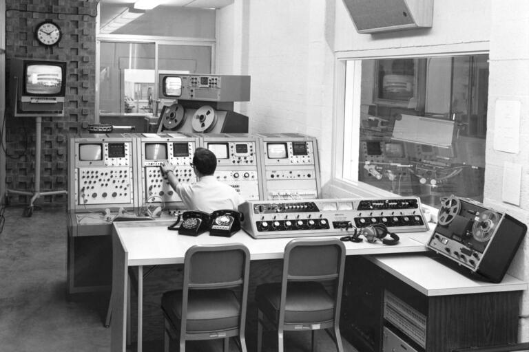 archival photo of man working in tv control room