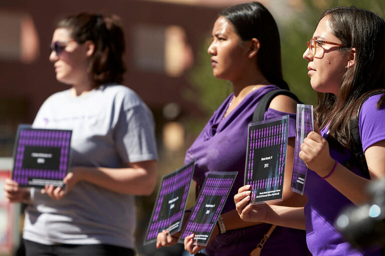 UNLV CARE Advocates Take Back Your [Power] silent march as part of Domestic Violence Awareness month.