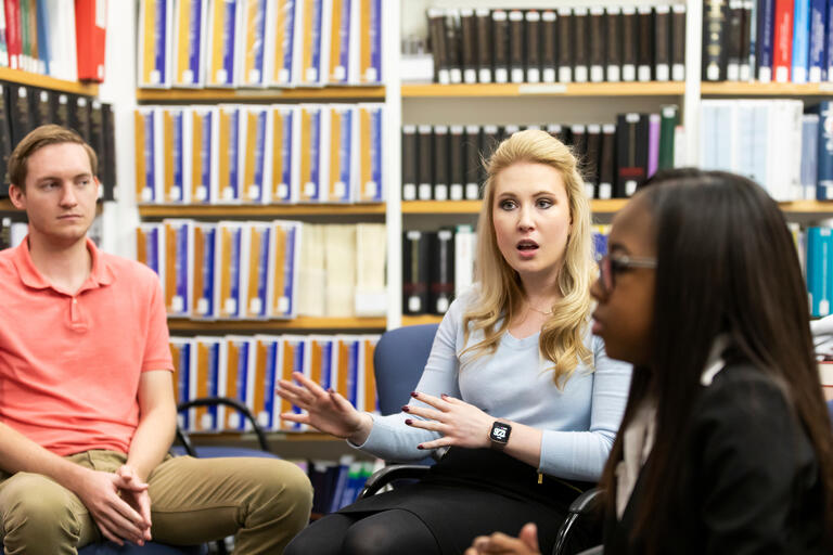 A group of law students in a discussion at a law clinic.