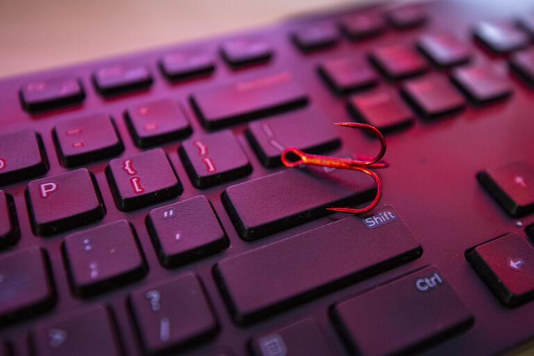 Phishing hook on keyboard
