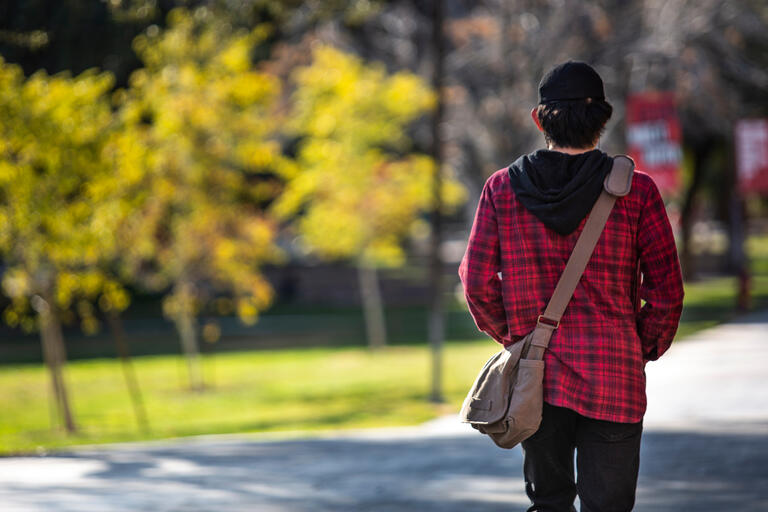 Student walking on UNLV campus.