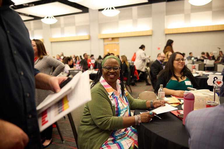 two women sitting at a table during the MSI Student Success Summit