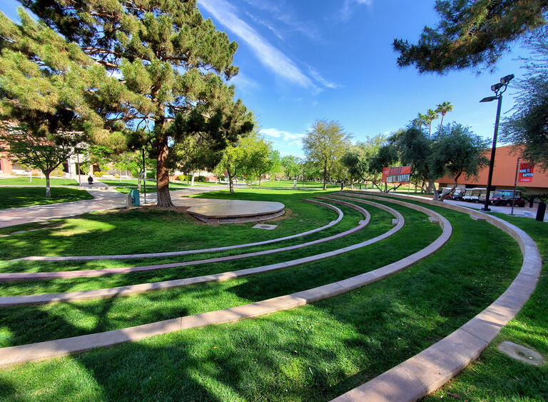 Cement stage with a tree and amphitheater seating