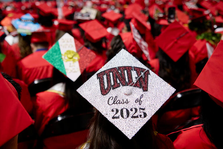 Closeup of a graduation cap decorated with the phrase UNLV 2025