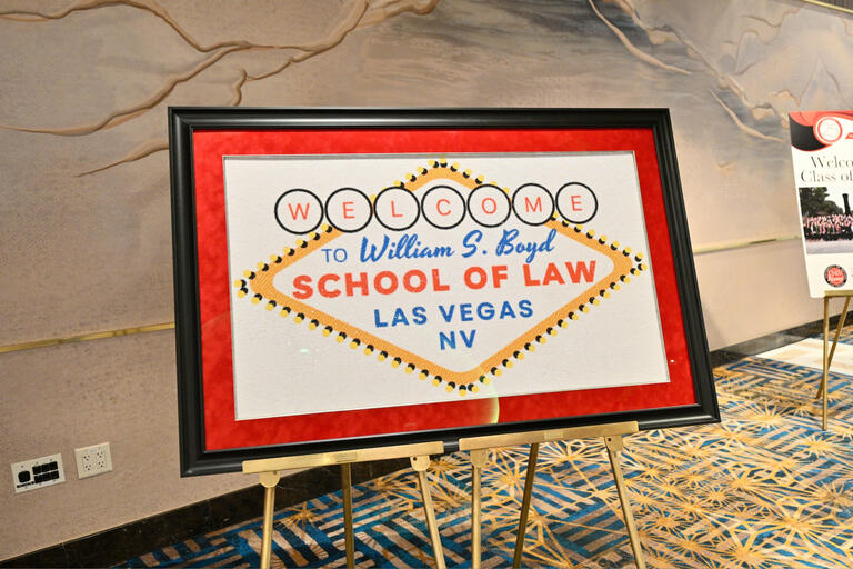 A sign on an easel that says "Welcome to William S. Boyd School of Law" in the style of the "Welcome to Fabulous Las Vegas" sign.