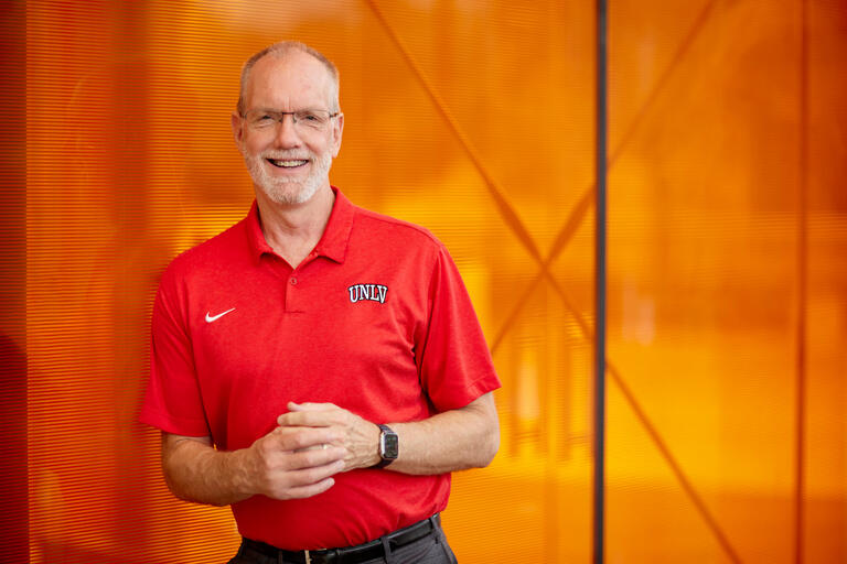 Chris Heavey in red Rebel athletic polo