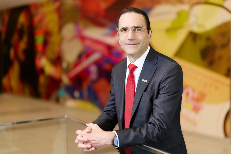 Chris Viton in suit and red tie