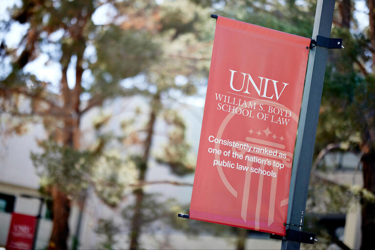 A picture of a banner that reads UNLV William S. Boyd Law School: Consistently ranked as one of the nation's top public law schools.