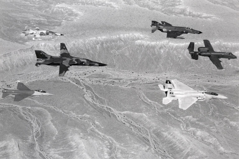 A Nellis Air Force Base archival photo of five aircrafts.