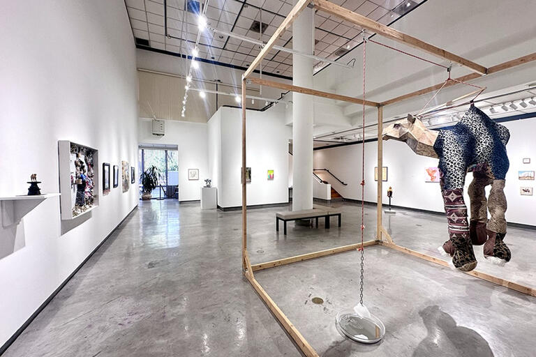 various artworks on display inside a gallery