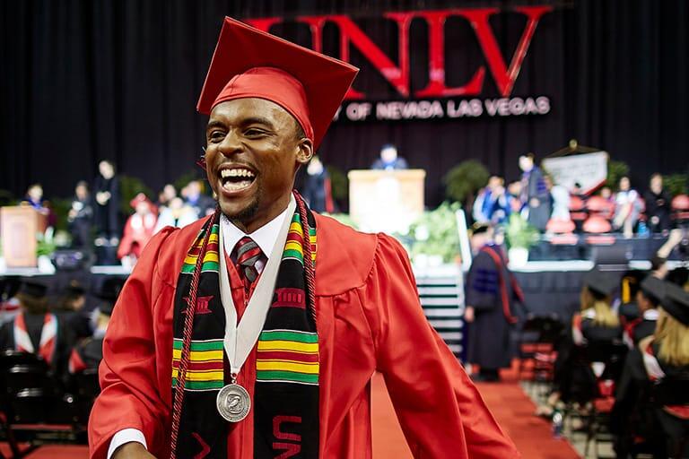 Male student smiling at graduation