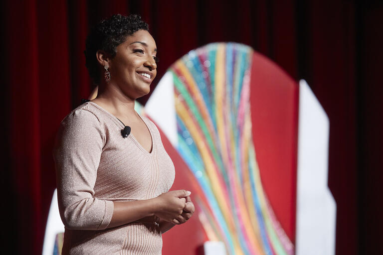 A photo of Akaisha Cook delivering a speech at the 2019 UNLV Foundation Annual Dinner.