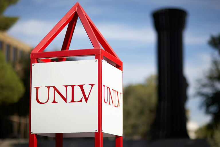 Signage with the UNLV logo on campus