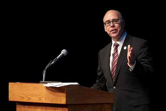 Neal Smatresk speaking at podium