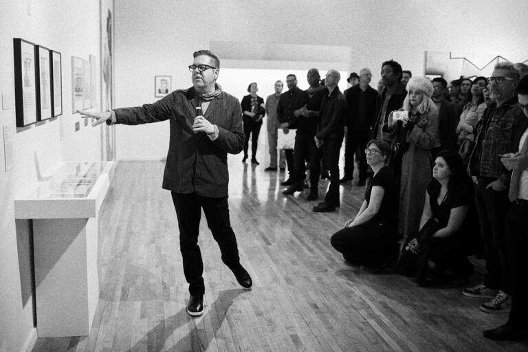 man leading gallery talk