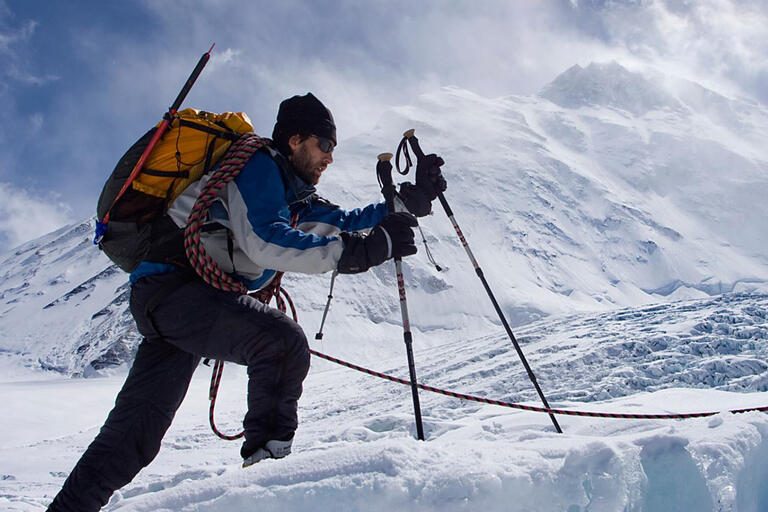 man trekking in snow