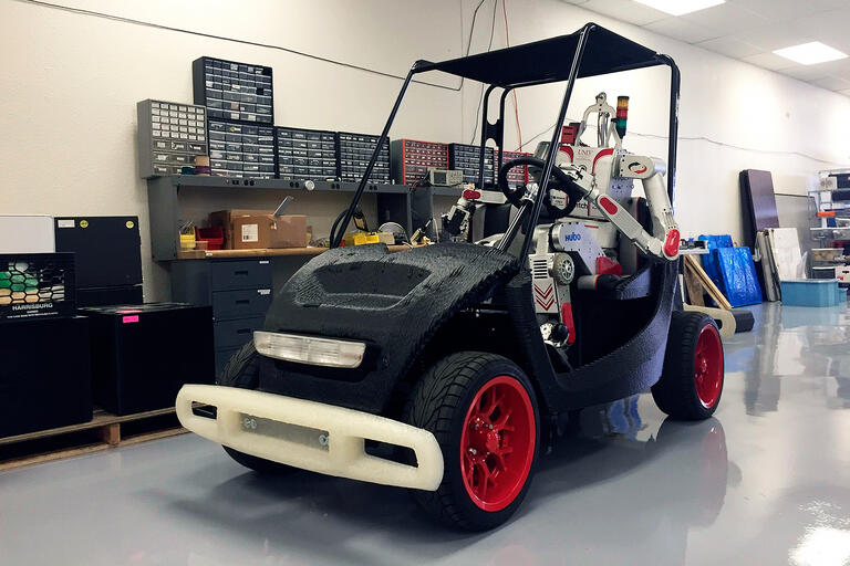 Metal Rebel behind the wheel of Local Motors' 3D-printed LOCO vehicle