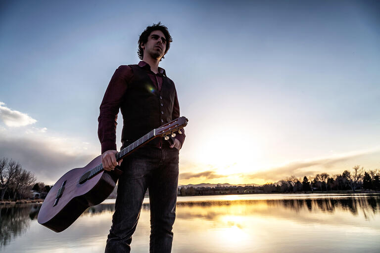 Mak Grgic holds guitar