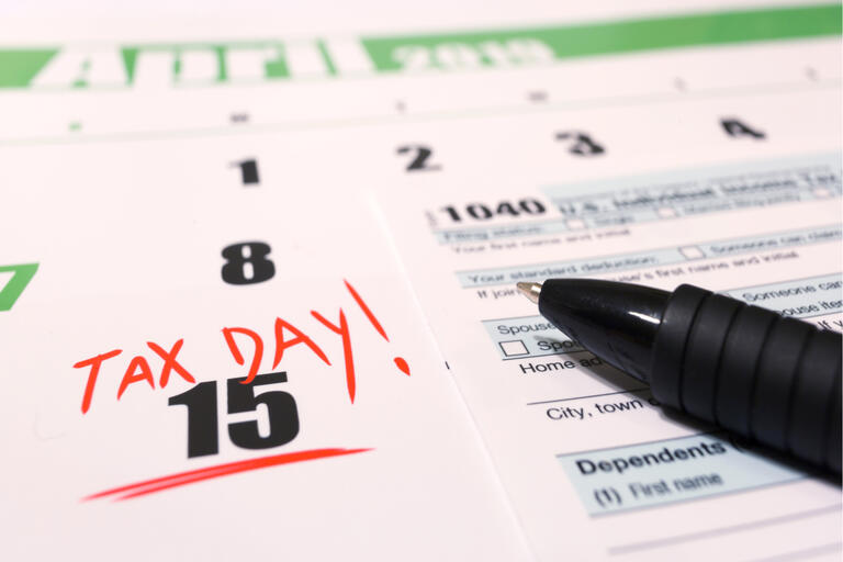 An image of a 1040 from and a calendar that highlights April 15, 2019 as tax day.