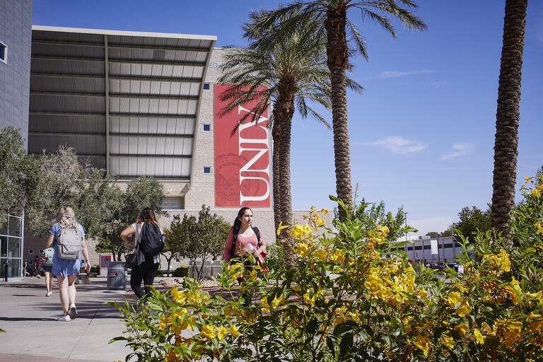 Students walking in front of UNLV's Lied Library