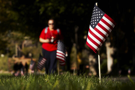U.S. flags scattered on the lawns of UNLV