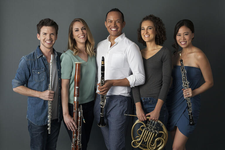 five musicians with wind instruments