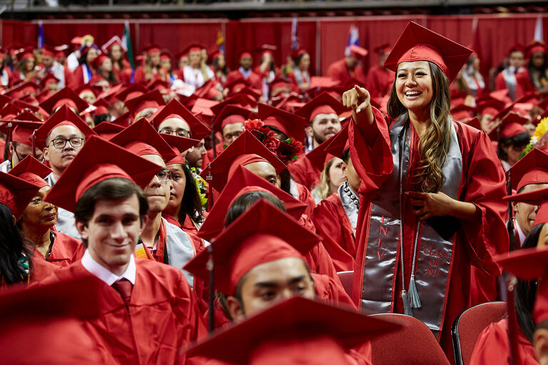 A group of graduates in red gown