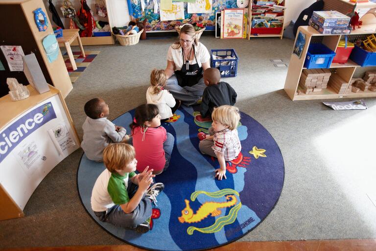 Children play inside the preschool