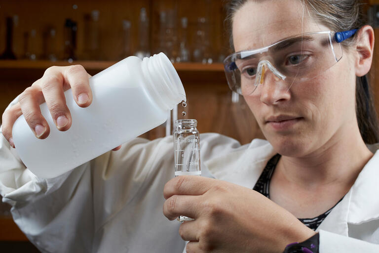 A woman in lab coat studying the water quality in the Las Vegas valley.