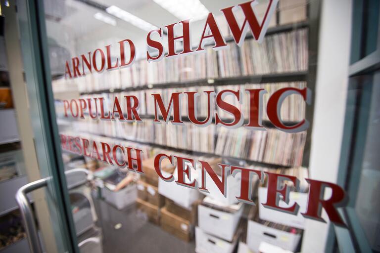 center entrance with shelves of vinyl records inside