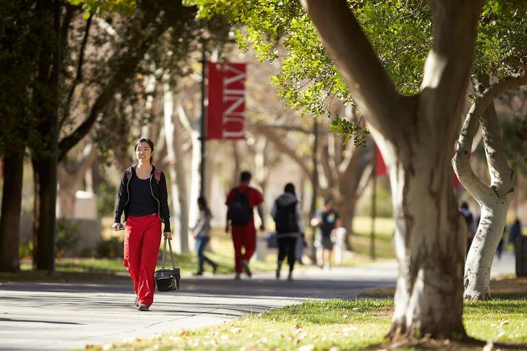 Student walks outside on campus