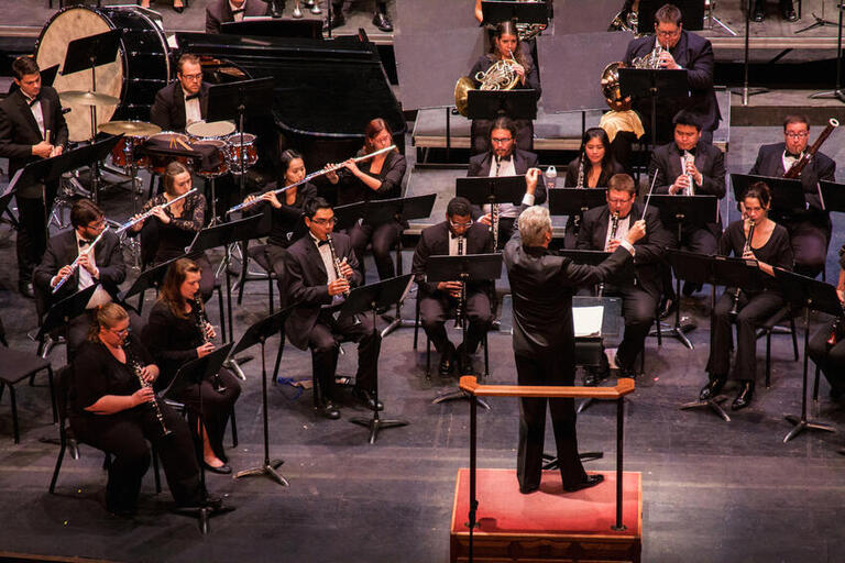 Tom Leslie conducts the Wind Orchestra on the Artemus W. Ham Concert Hall stage.