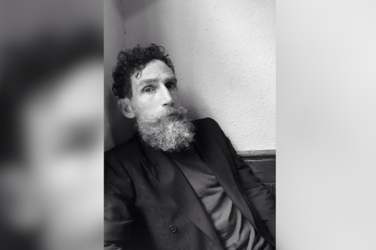 Headshot of Brock Norman Brock, man with beard.