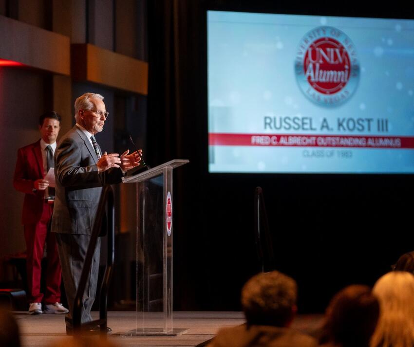 A person speaking at a podium