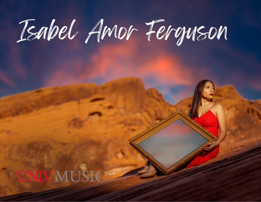 Isabel Amor Ferguson, a music student, sits on a rock while looking over her shoulder to the left. The desert mountains are in the background and she is holding a large mirror that is reflecting the sky at sunset.