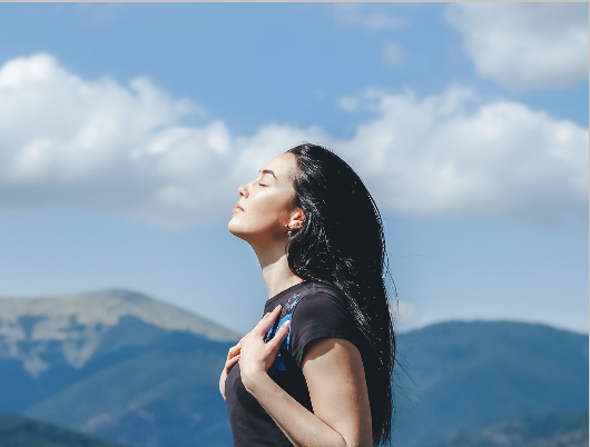 A woman practicing deep breathing