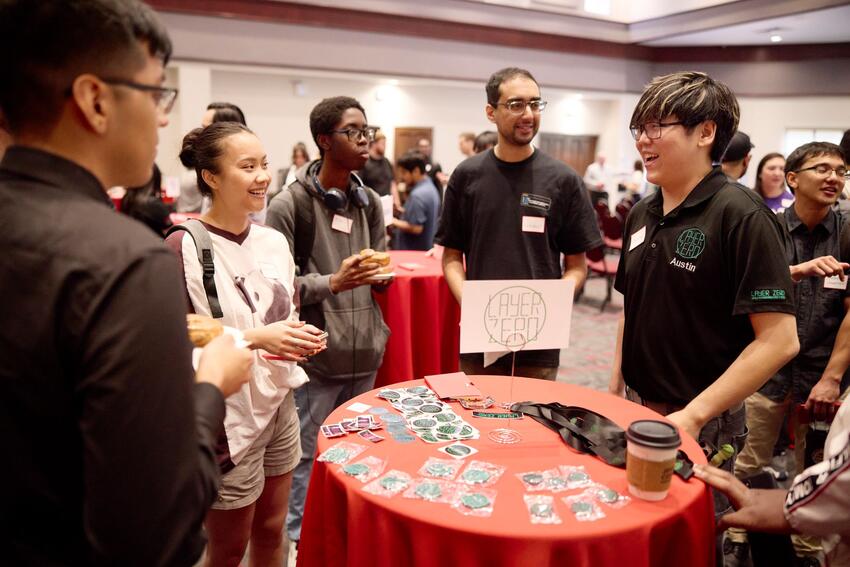 Group of students talking at a Cyberweek @ UNLV event