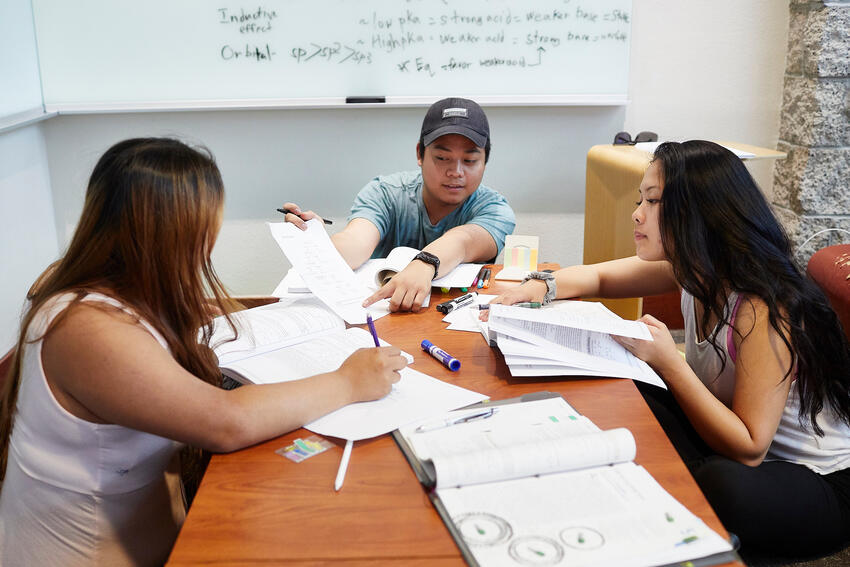 Three students studying together.