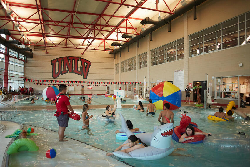 Students swimming at the Student Wellness and Recreation Center pool.
