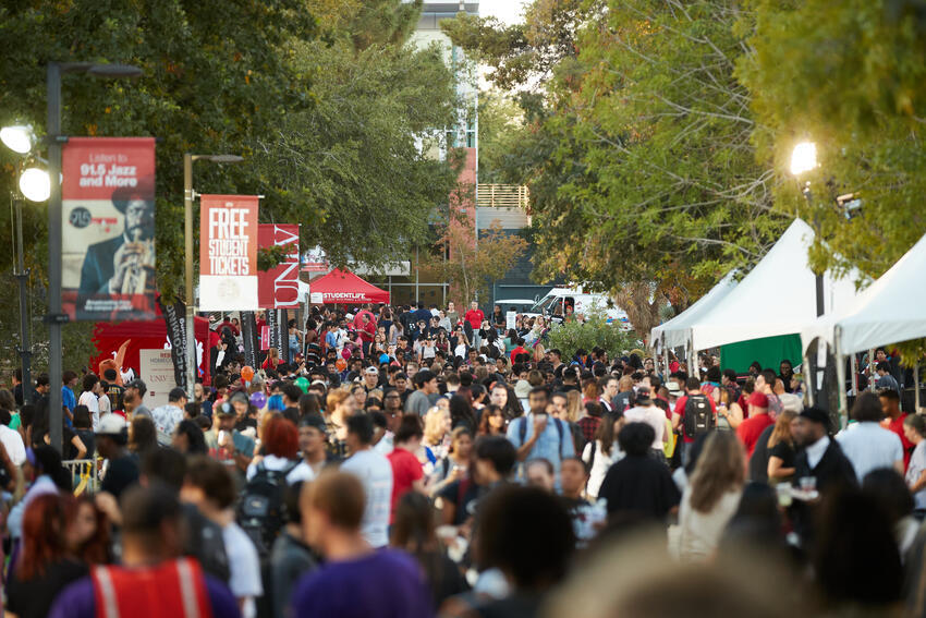 Large crowd of students roaming through the academic mall during Homecoming Festival